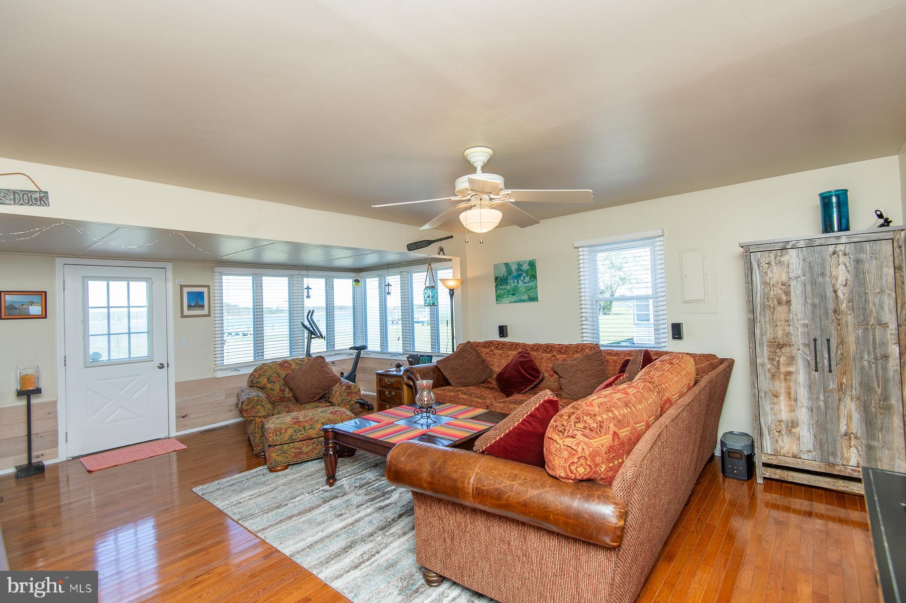 5558 Bowen Road Cambridge, MD 21613 - Photo 10 of 33 a living room with furniture and a large window