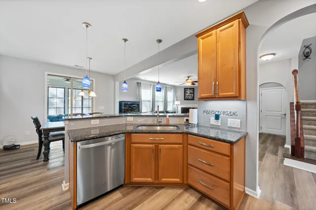 a kitchen with a sink stove and cabinets