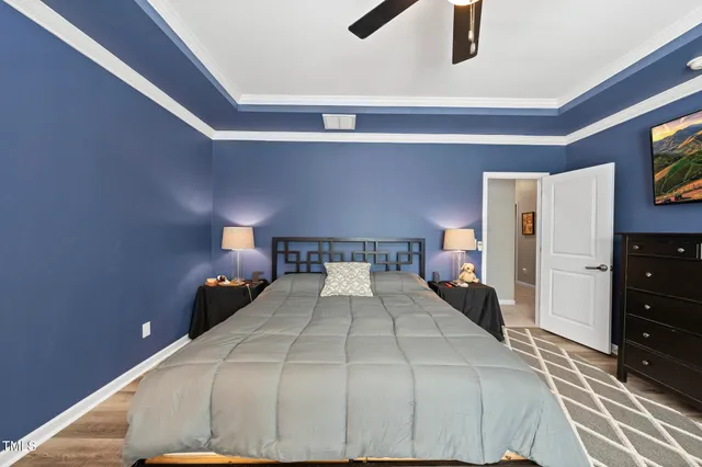 a bed room with a bed and a lamp on table