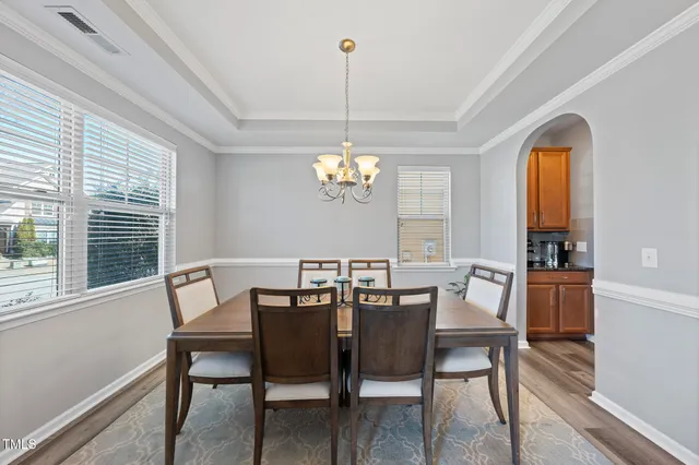 a view of a dining room with furniture window and outside view