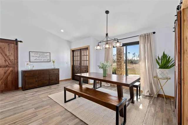 a view of a livingroom with furniture window and wooden floor