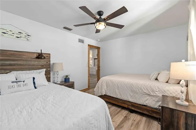 a spacious bathroom with a toilet sink and mirror