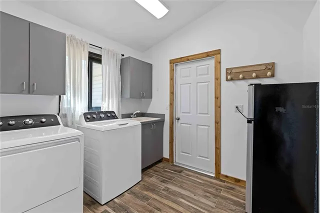 a view of a porch with wooden floor and a potted plant