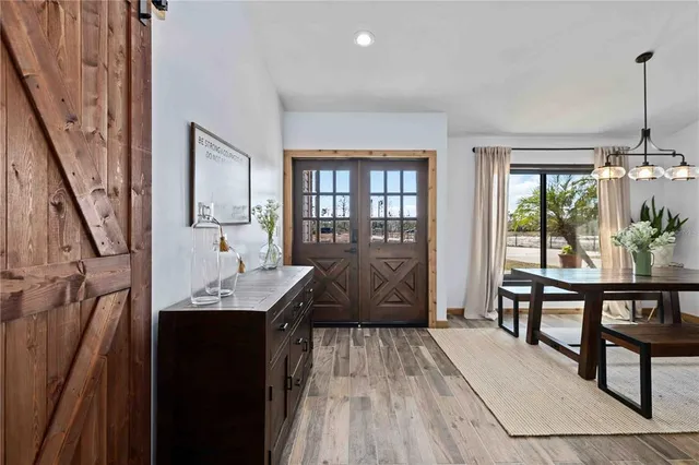 a view of a livingroom with furniture window and wooden floor