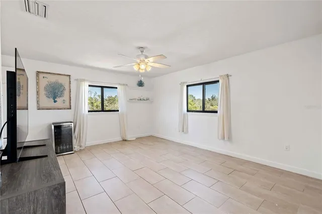 a view of a livingroom with furniture and a flat screen tv