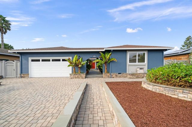 a view of entryway of house with car parked