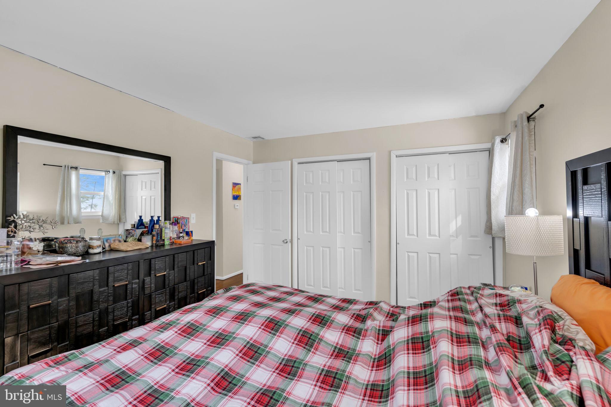 463 Ensign Road Forked River, NJ 08731 - Photo 13 of 21 a bedroom with a bed and a dresser