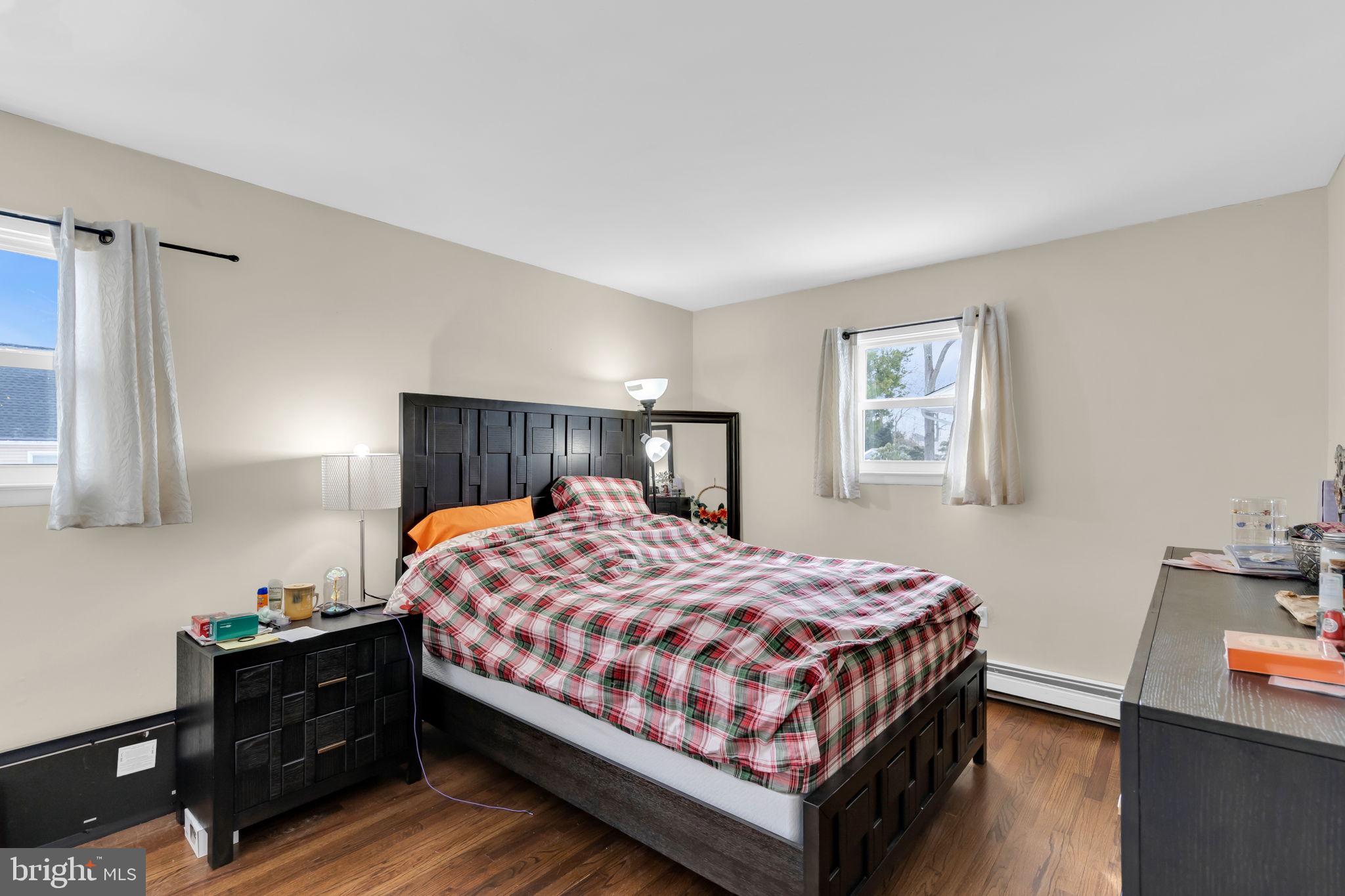 463 Ensign Road Forked River, NJ 08731 - Photo 14 of 21 a bedroom with a bed and a night stand