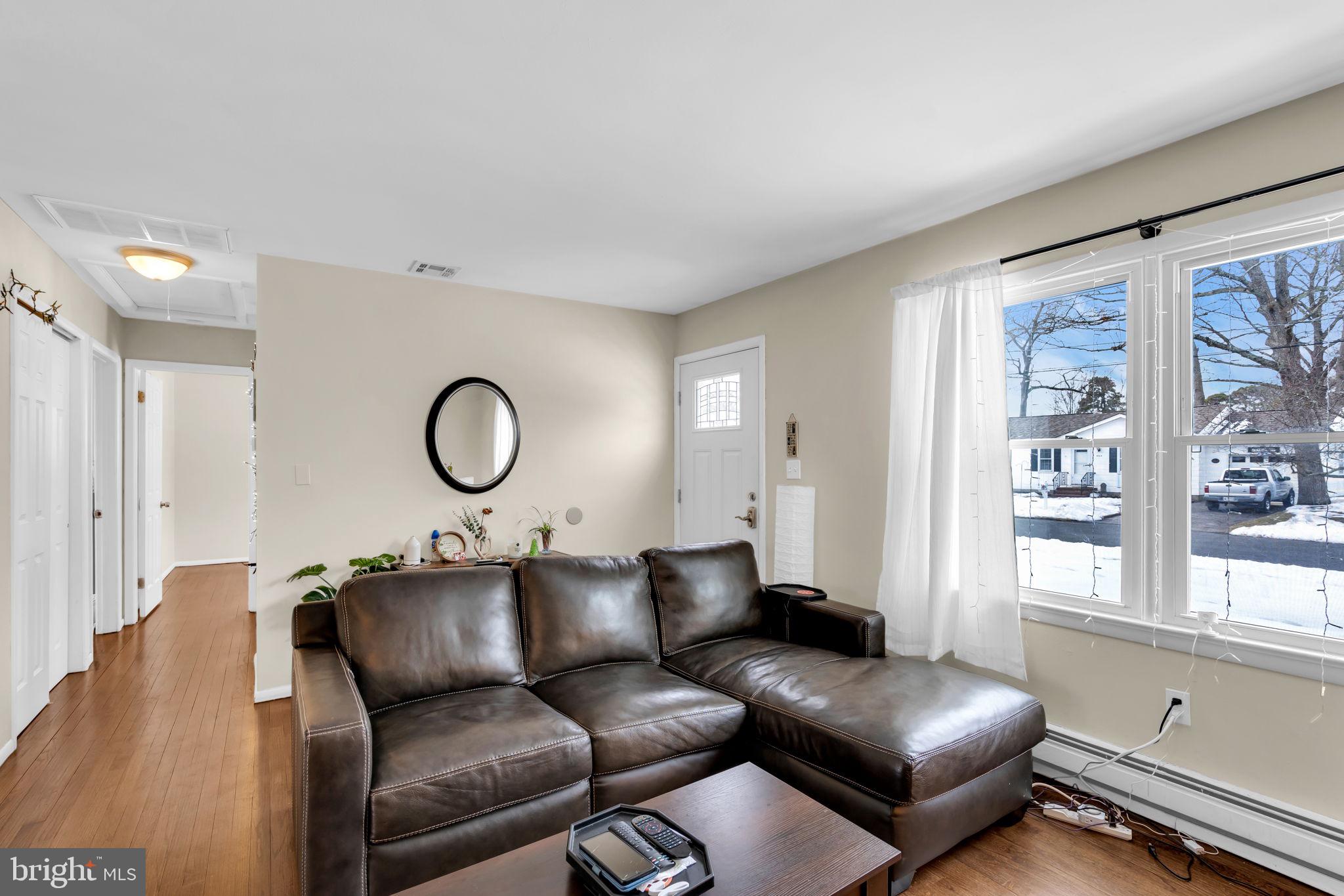 463 Ensign Road Forked River, NJ 08731 - Photo 4 of 21 a living room with furniture window and wooden floor