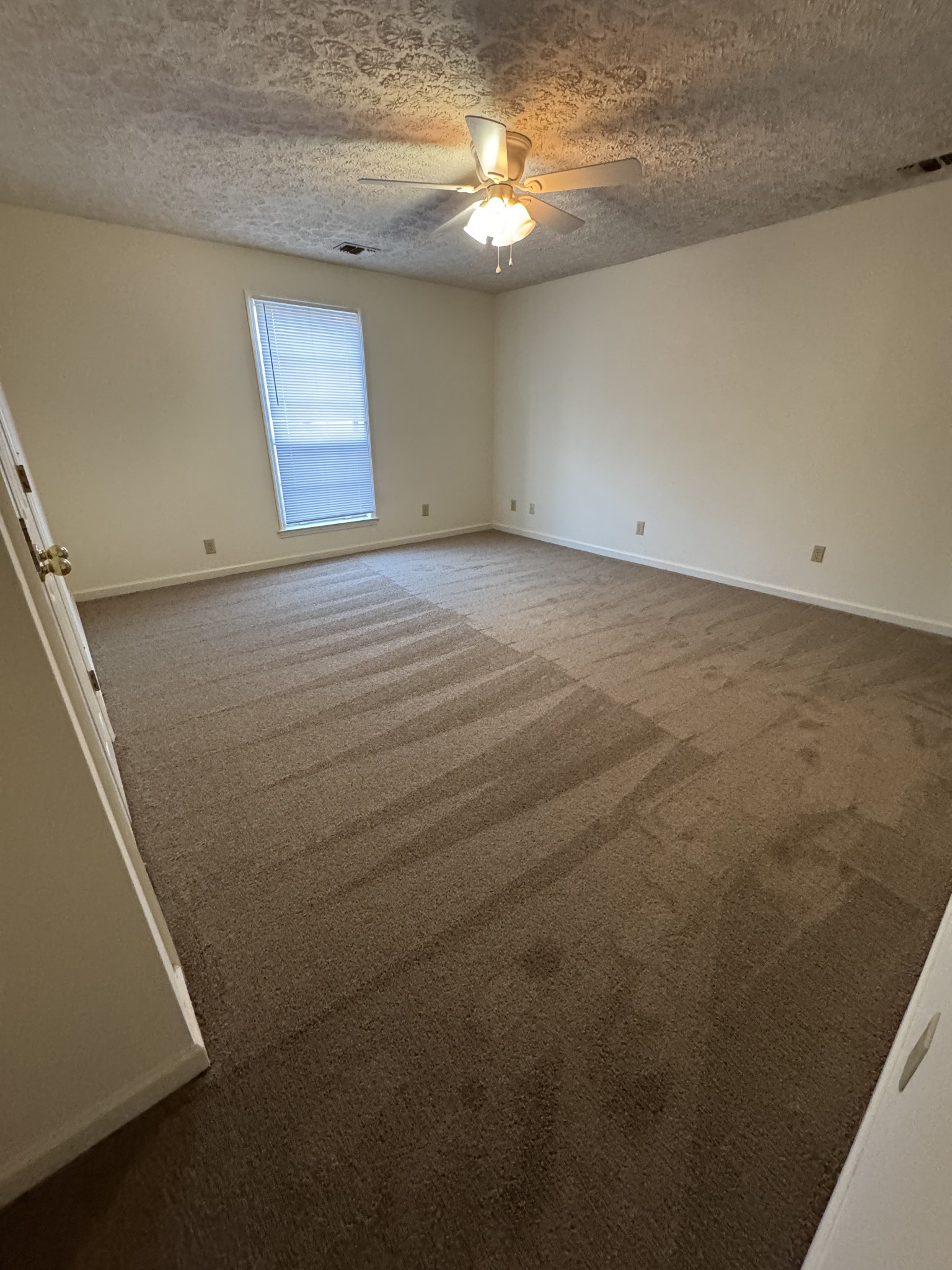 1714 Monument Lane, Unit B Lebanon, TN 37087 - Photo 4 of 9 wooden floor in an empty room with a window