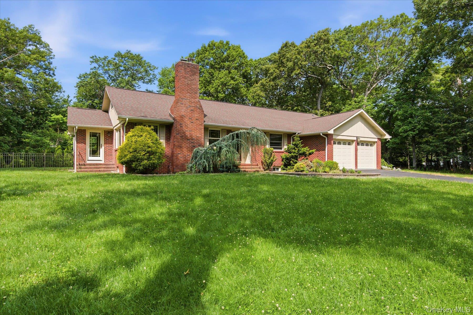 42 Cliff Road Port Jefferson, NY 11777 - Photo 3 of 22 a front view of house with yard and green space
