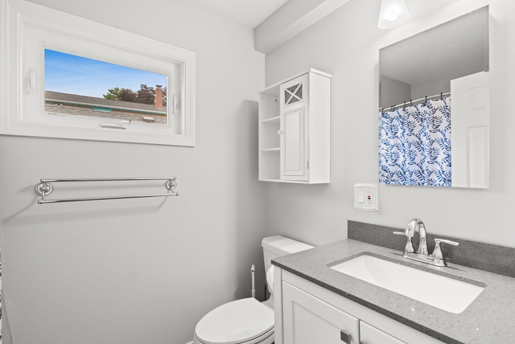 106 Circuit Avenue Wareham, MA 02571 - Photo 17 of 34 a bathroom with a granite countertop sink mirror vanity and toilet