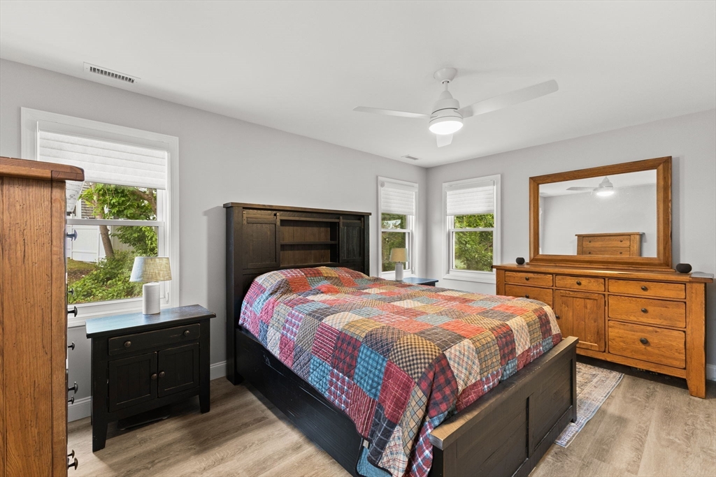 106 Circuit Avenue Wareham, MA 02571 - Photo 21 of 34 a bedroom with a large bed and a dresser