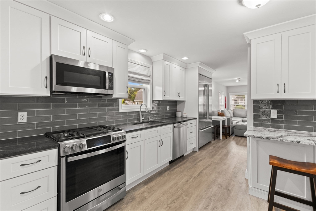106 Circuit Avenue Wareham, MA 02571 - Photo 8 of 34 a kitchen with stainless steel appliances a stove sink microwave and cabinets