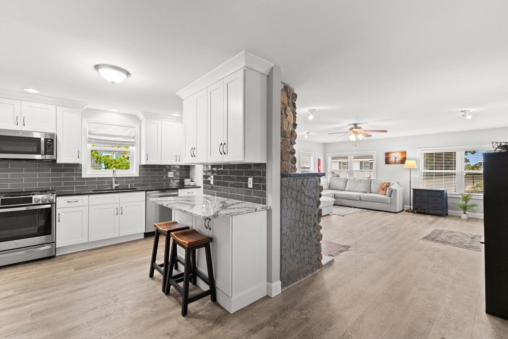 106 Circuit Avenue Wareham, MA 02571 - Photo 10 of 34 a kitchen with a refrigerator and window