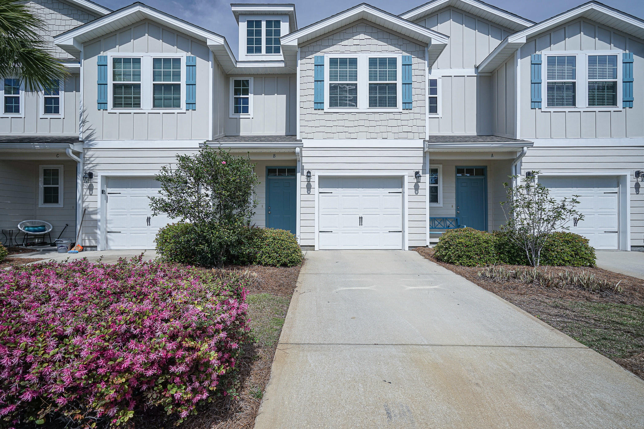 19 East Shady Oaks Lane, Unit B Santa Rosa Beach, FL 32459 - Photo 1 of 35 a front view of a house with a yard