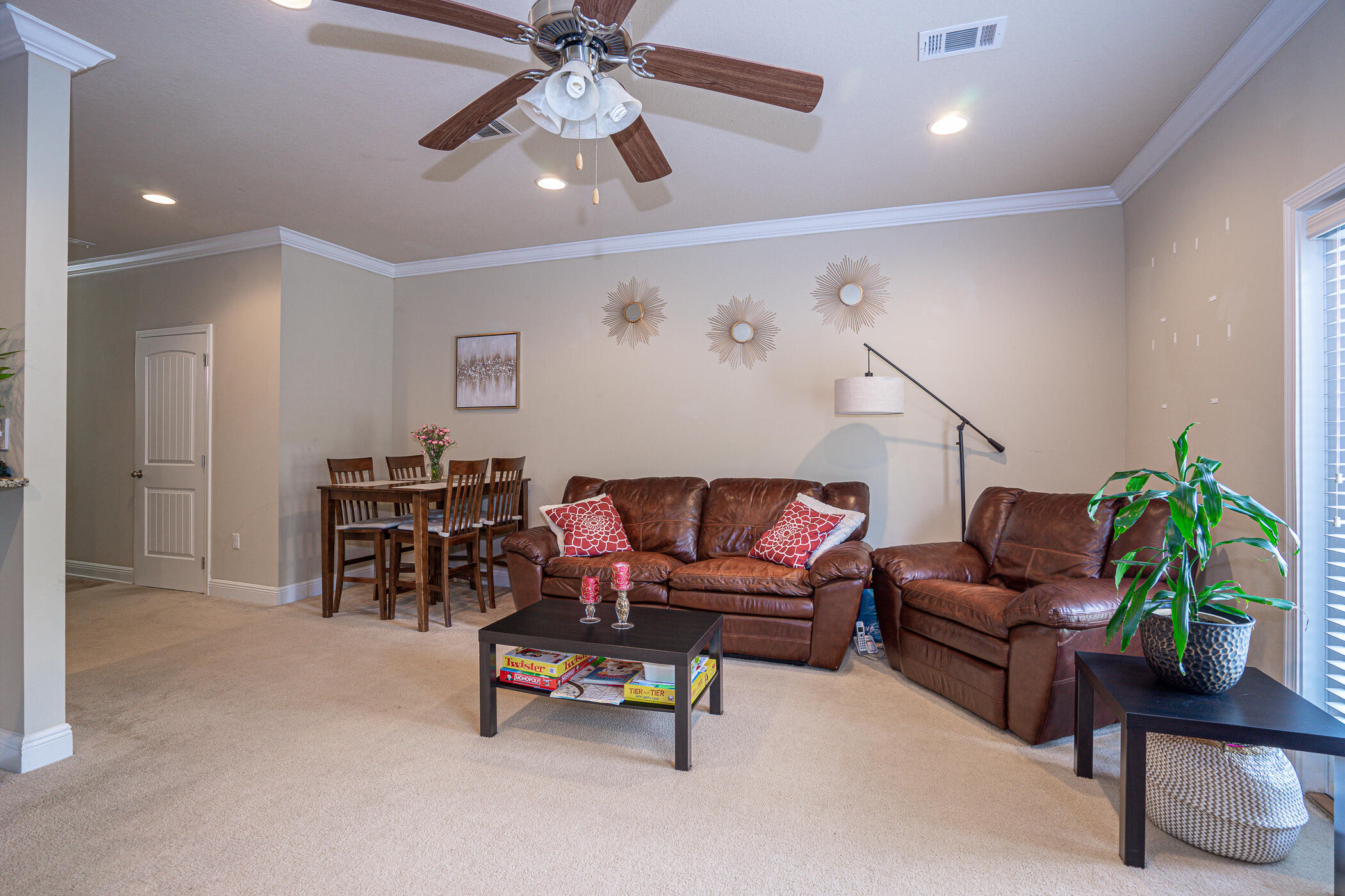 19 East Shady Oaks Lane, Unit B Santa Rosa Beach, FL 32459 - Photo 13 of 35 a living room with furniture and a chandelier