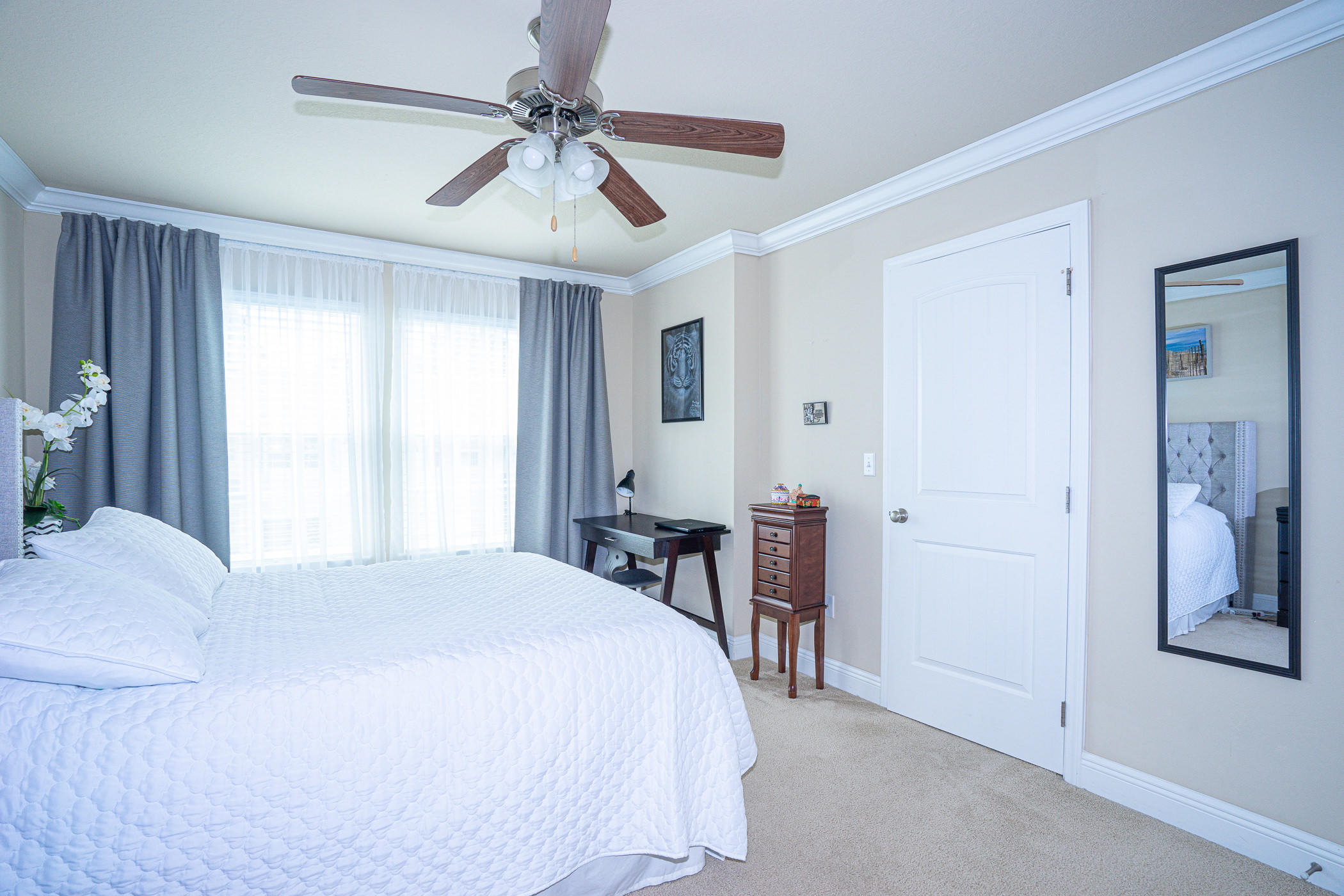 19 East Shady Oaks Lane, Unit B Santa Rosa Beach, FL 32459 - Photo 21 of 35 a bed room with a bed and a chandelier