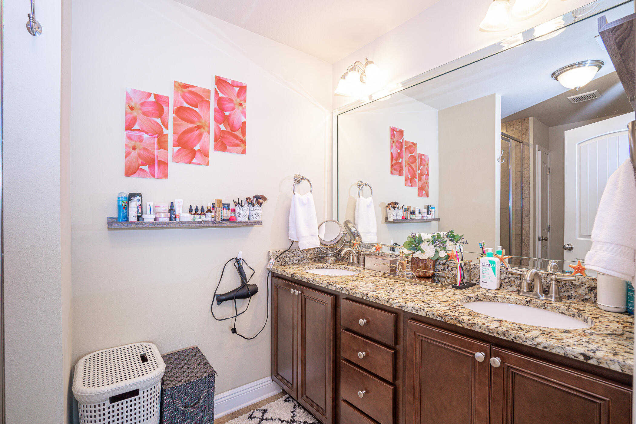 19 East Shady Oaks Lane, Unit B Santa Rosa Beach, FL 32459 - Photo 25 of 35 a bathroom with a granite countertop sink a mirror and a shower