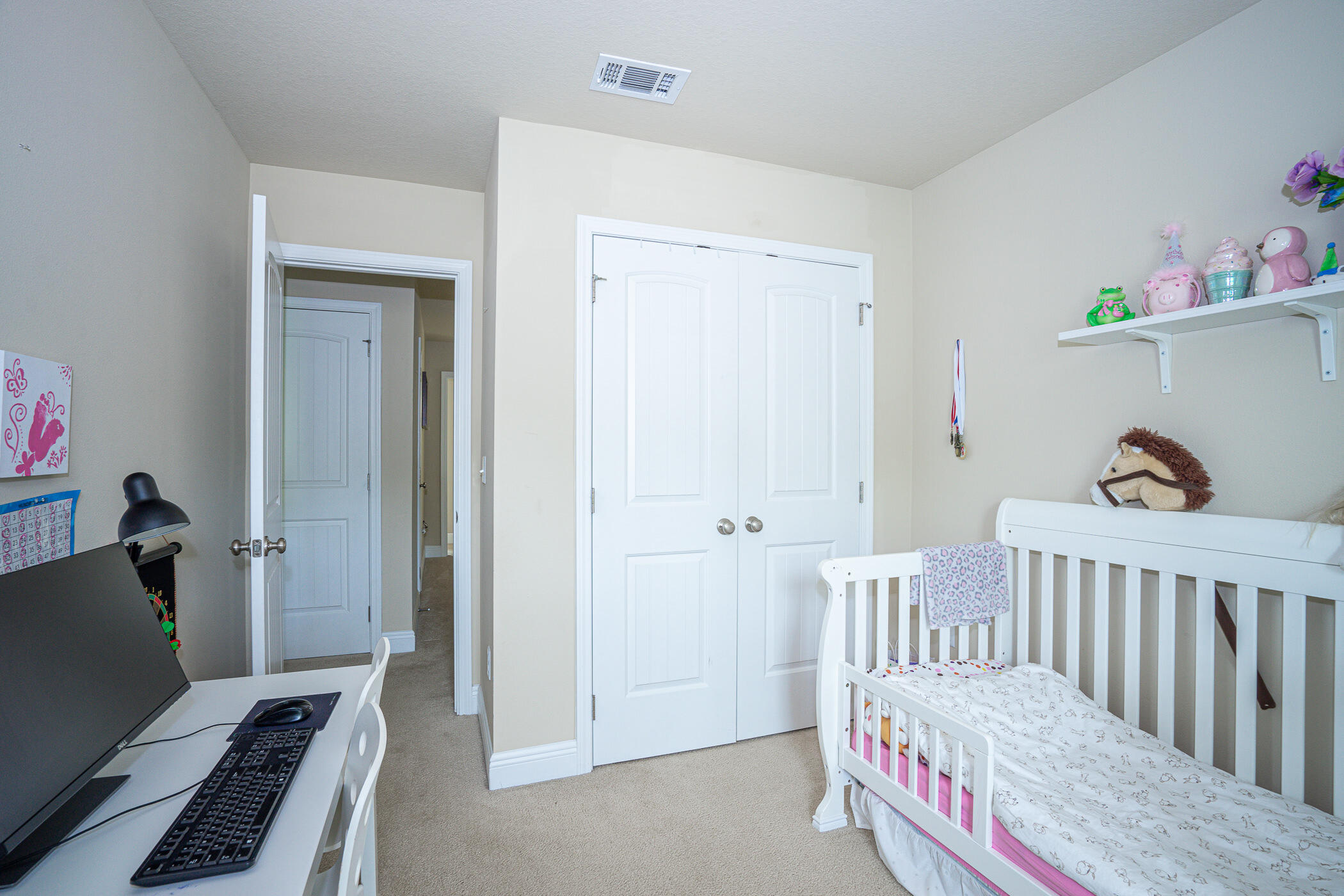 19 East Shady Oaks Lane, Unit B Santa Rosa Beach, FL 32459 - Photo 27 of 35 a bedroom with a bed and wooden floor