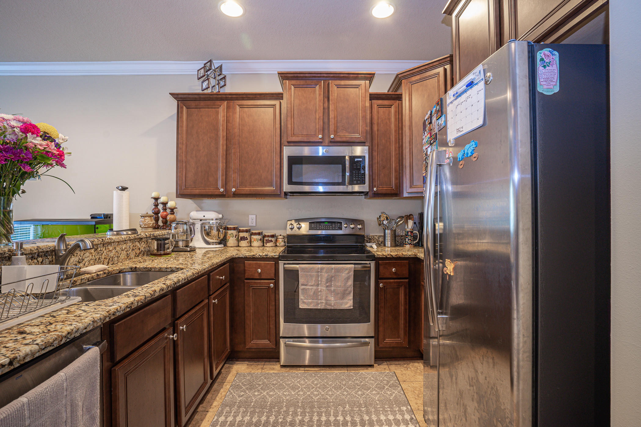 19 East Shady Oaks Lane, Unit B Santa Rosa Beach, FL 32459 - Photo 5 of 35 a kitchen with stainless steel appliances granite countertop a refrigerator a stove and a sink