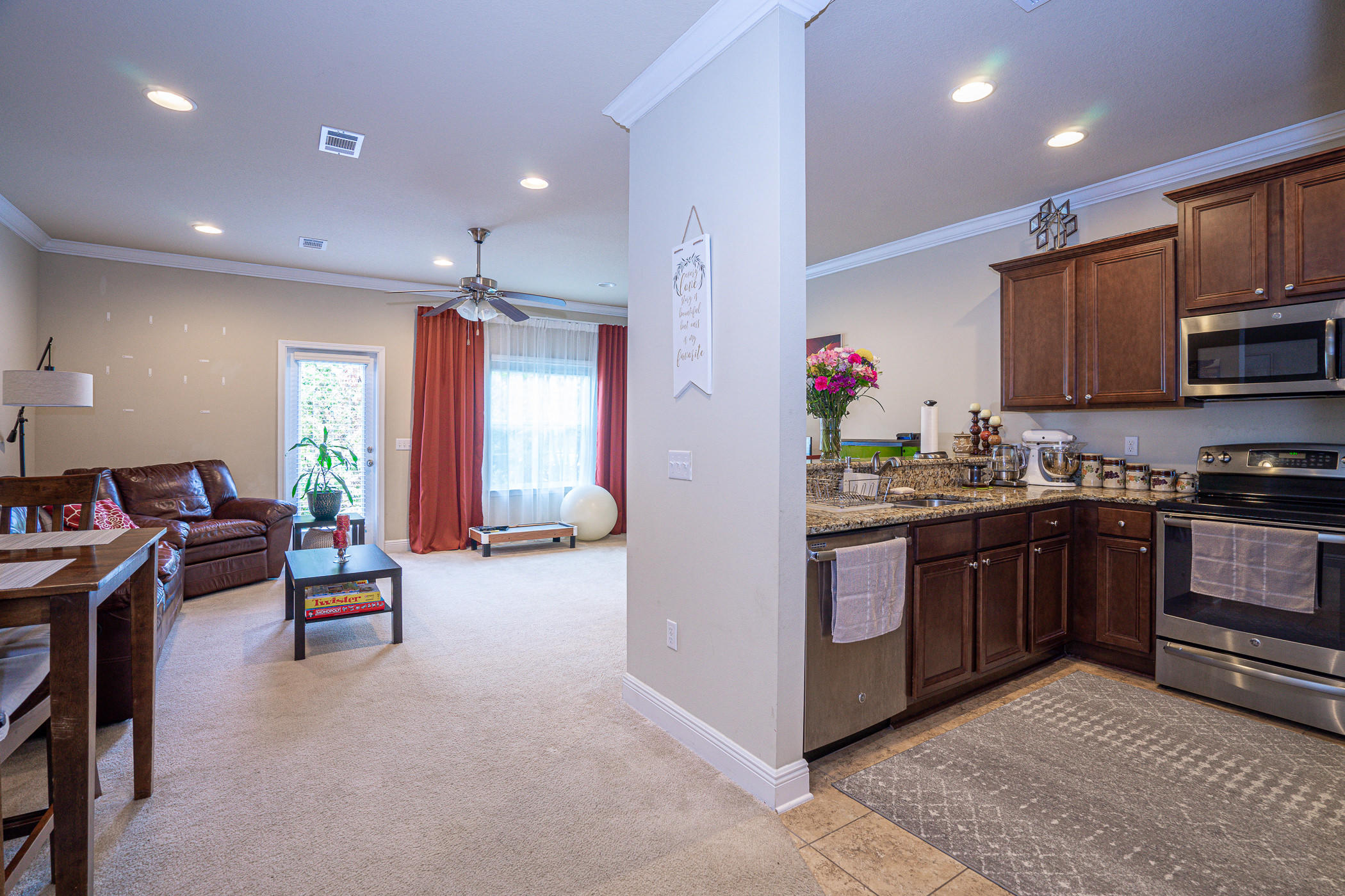 19 East Shady Oaks Lane, Unit B Santa Rosa Beach, FL 32459 - Photo 6 of 35 a kitchen with sink refrigerator and cabinets