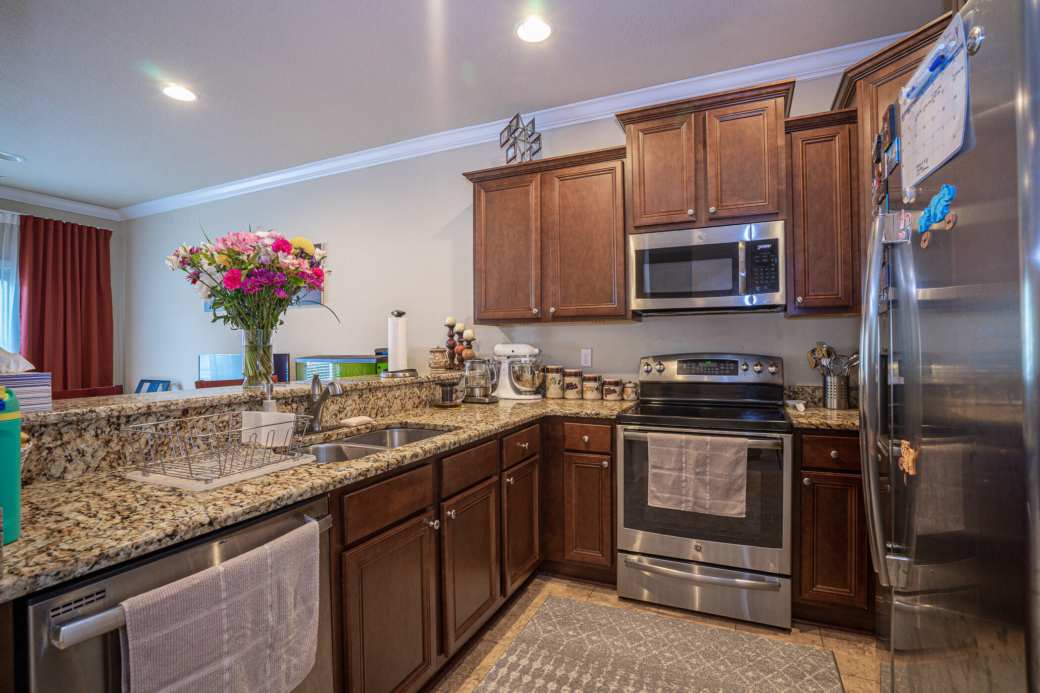 19 East Shady Oaks Lane, Unit B Santa Rosa Beach, FL 32459 - Photo 7 of 35 a kitchen with stainless steel appliances granite countertop a sink stove and microwave