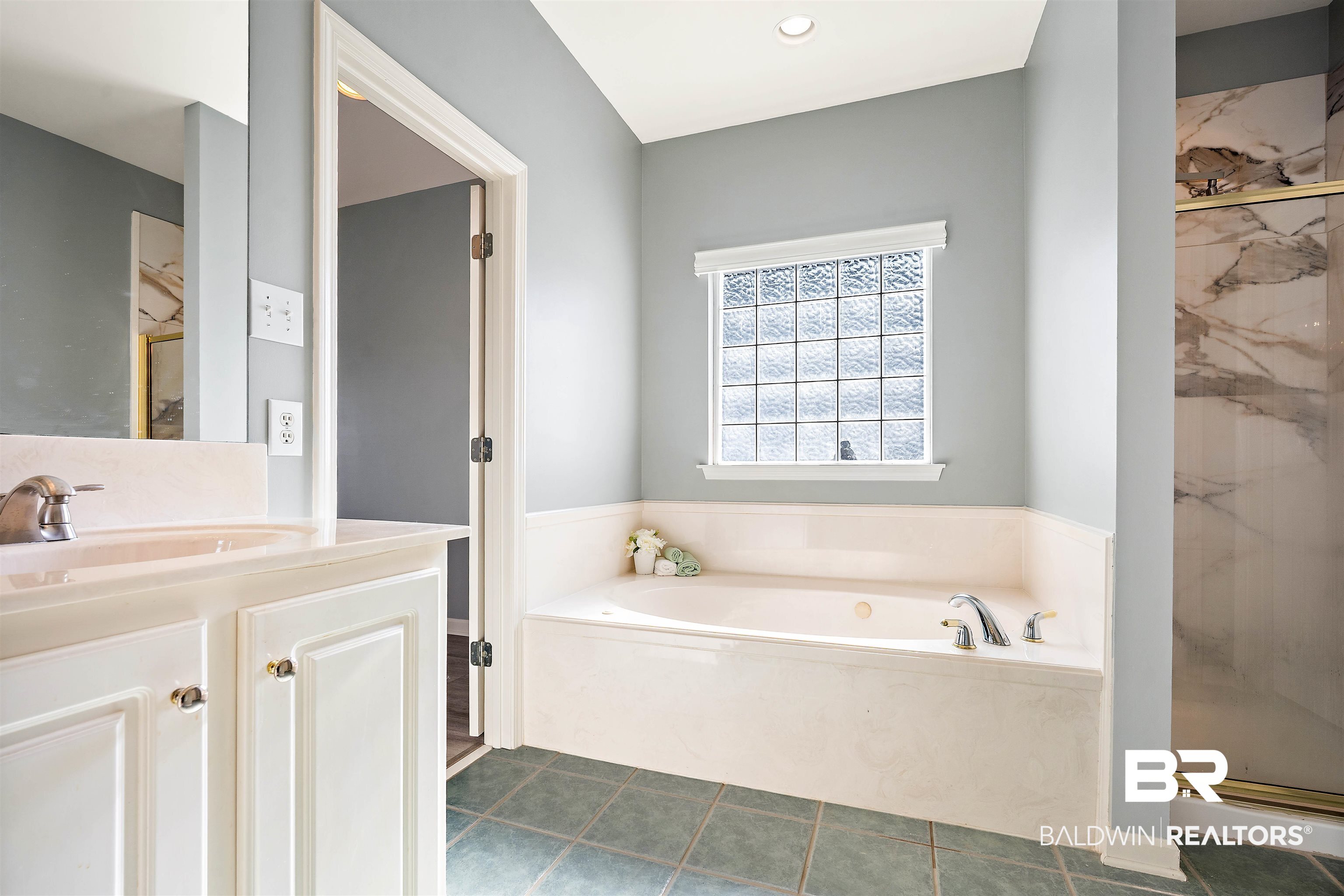 615 Summerlake Place Mobile, AL 36608 - Photo 19 of 35 Full bath with a marble finish shower, a garden tub, vanity, and dark tile patterned floors