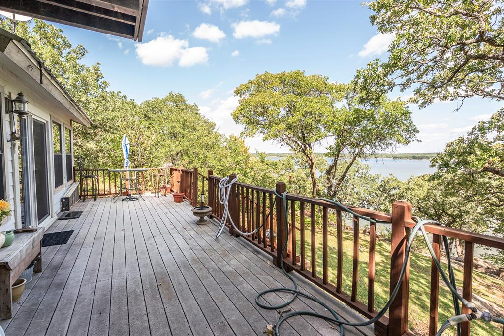 698 Storey Road Nocona, TX 76255 - Photo 14 of 34 Wooden deck featuring a water view