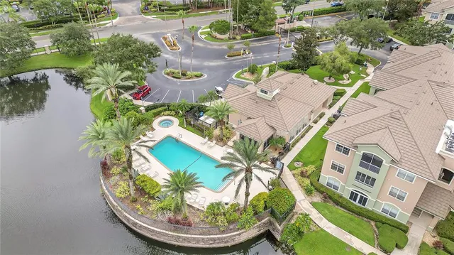 an aerial view of a house with a swimming pool