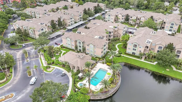 an aerial view of a house with a lake view