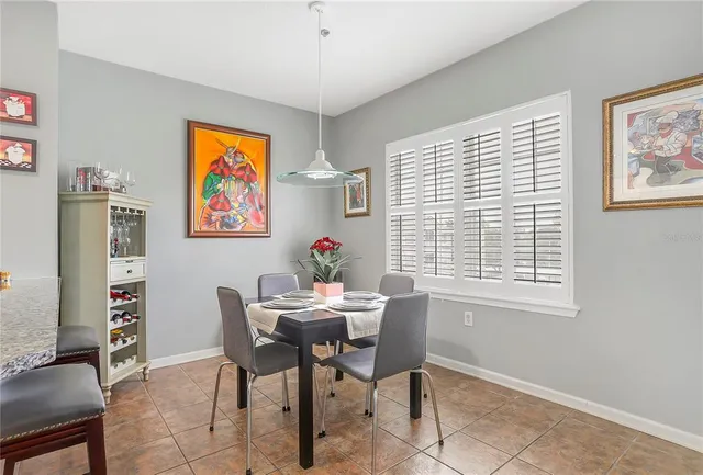 a dining room with furniture and window