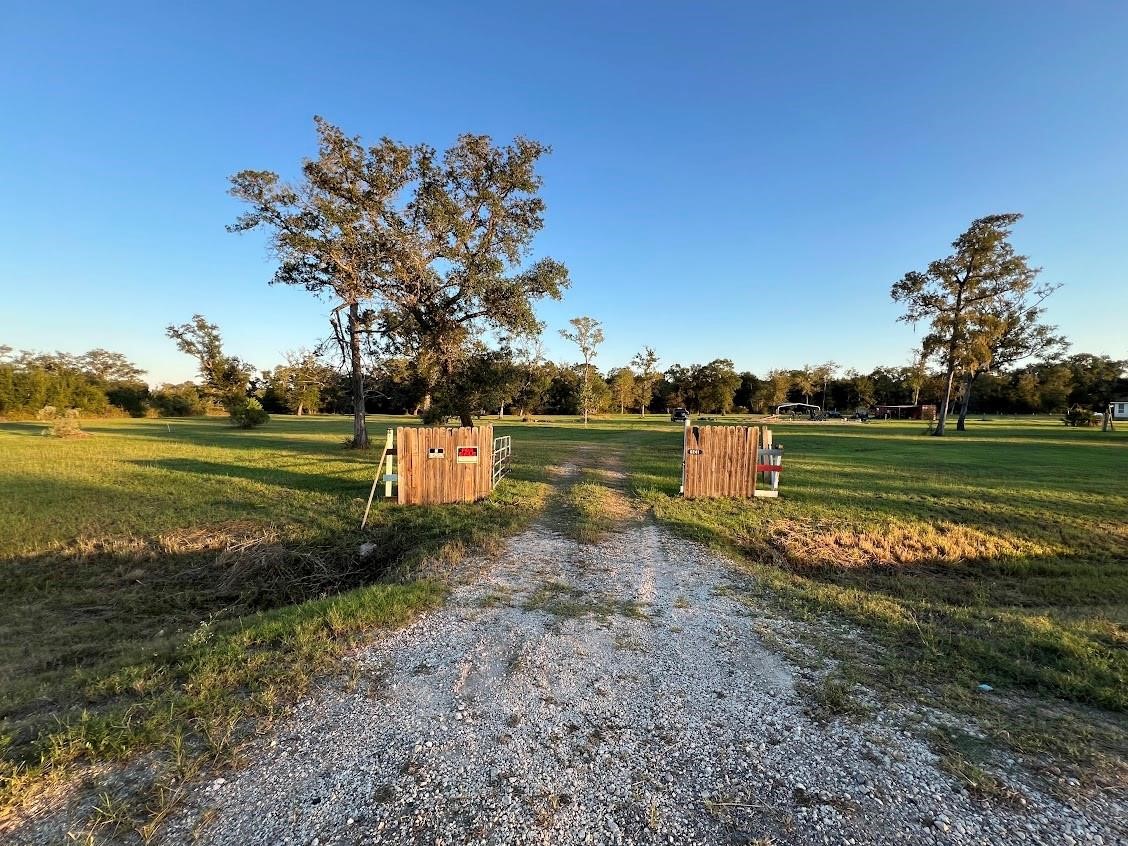 6233 County Road 3 Sweeny, TX 77480 - Photo 11 of 14 a view of a lake with a big yard