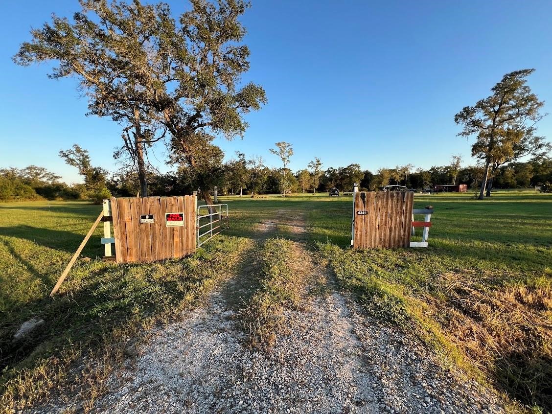 6233 County Road 3 Sweeny, TX 77480 - Photo 13 of 14 a backyard of a house with lots of green space