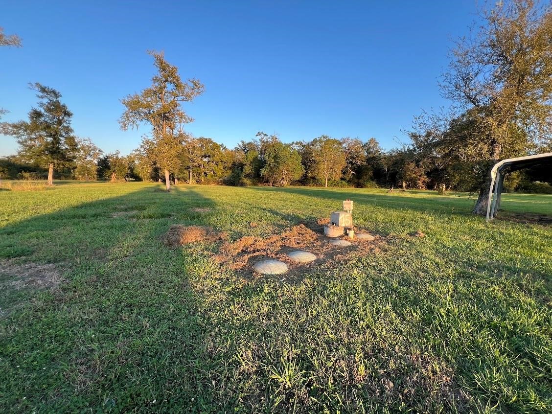 6233 County Road 3 Sweeny, TX 77480 - Photo 7 of 14 a view of a golf course with a lake