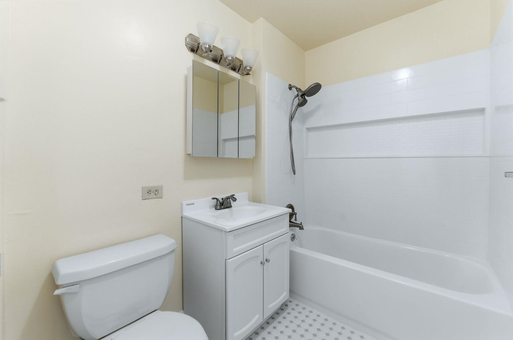 1111 River Road, Unit C6 Edgewater, NJ 07020 - Photo 12 of 16 a bathroom with a toilet sink and bathtub