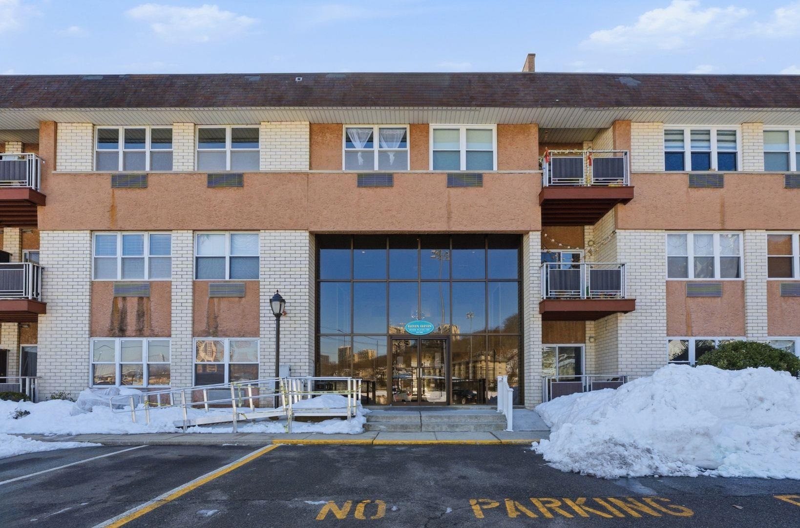 1111 River Road, Unit C6 Edgewater, NJ 07020 - Photo 16 of 16 a front view of a house with a yard