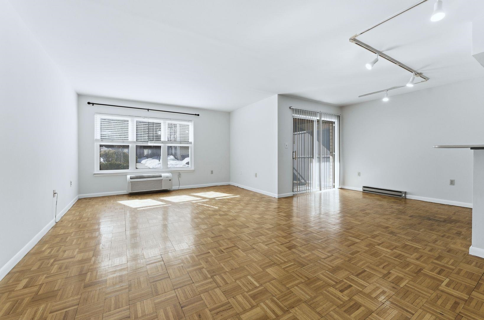 1111 River Road, Unit C6 Edgewater, NJ 07020 - Photo 2 of 16 an empty room with a empty space and windows