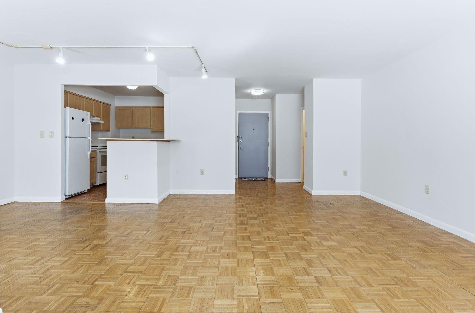1111 River Road, Unit C6 Edgewater, NJ 07020 - Photo 3 of 16 a view of a kitchen with a sink and a refrigerator