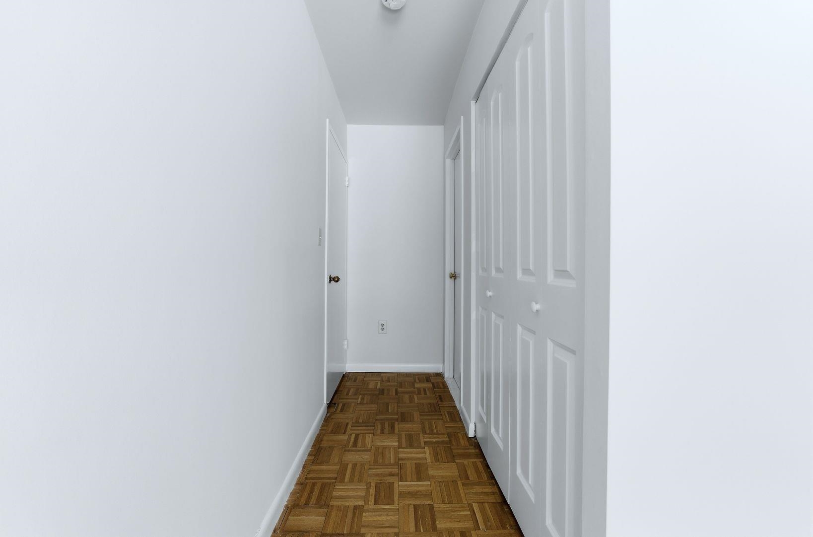 1111 River Road, Unit C6 Edgewater, NJ 07020 - Photo 8 of 16 a view of a bathroom with sink and wooden floor