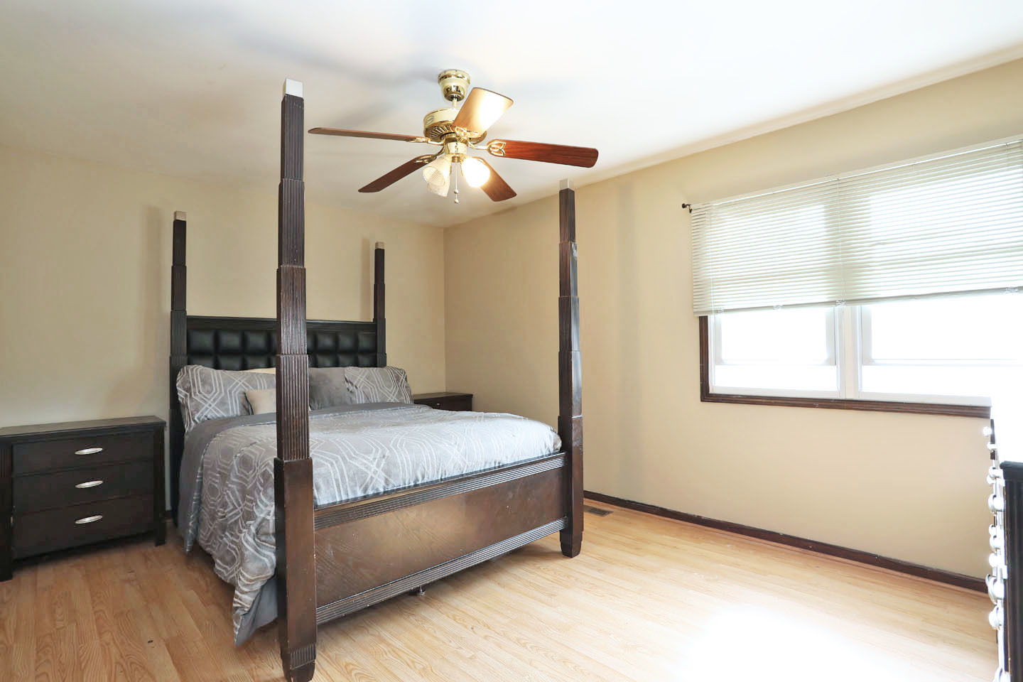 4624 Thornbark Drive Hoffman Estates, IL 60192 - Photo 12 of 30 a bedroom with a bed and a chandelier