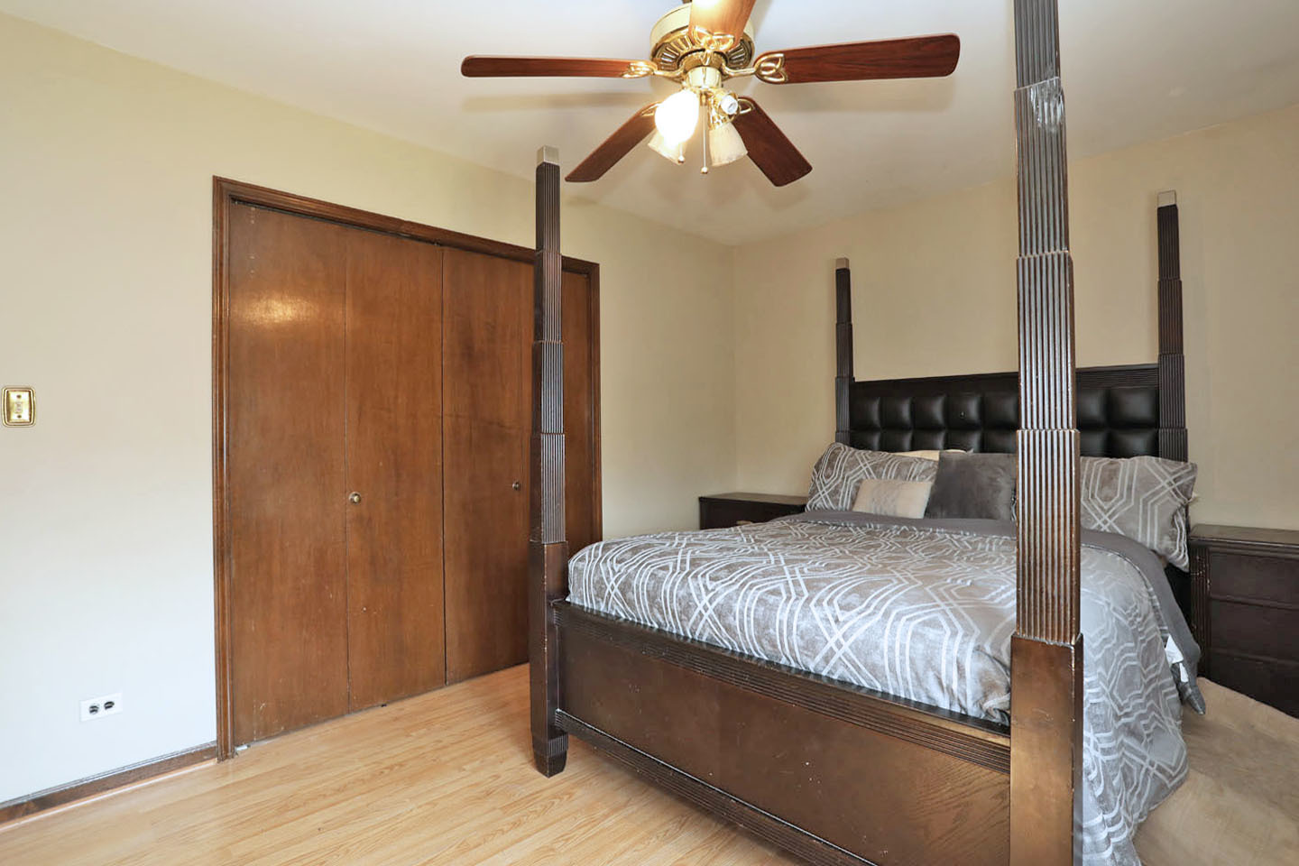 4624 Thornbark Drive Hoffman Estates, IL 60192 - Photo 13 of 30 a bedroom with a bed and a chandelier