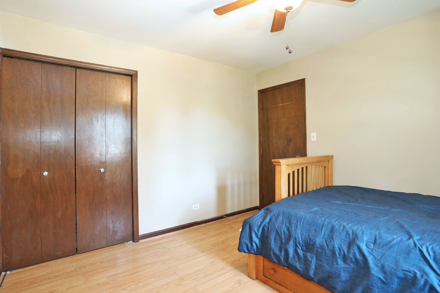4624 Thornbark Drive Hoffman Estates, IL 60192 - Photo 17 of 30 a view of a bedroom with a bed and wooden floor