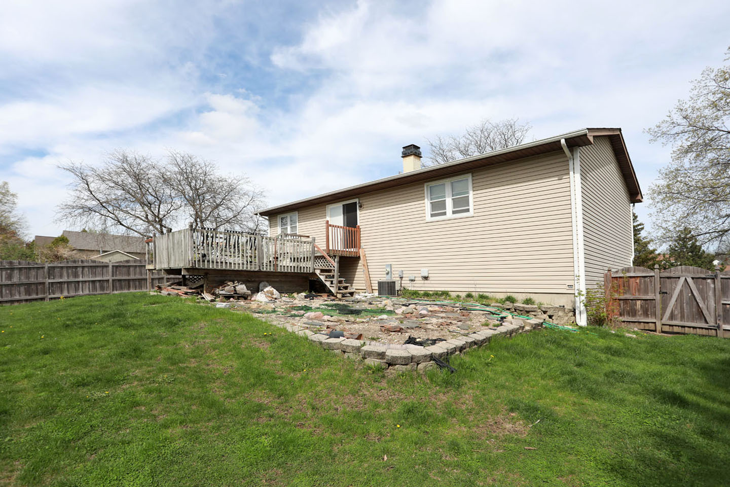 4624 Thornbark Drive Hoffman Estates, IL 60192 - Photo 24 of 30 a view of backyard of house with wooden fence