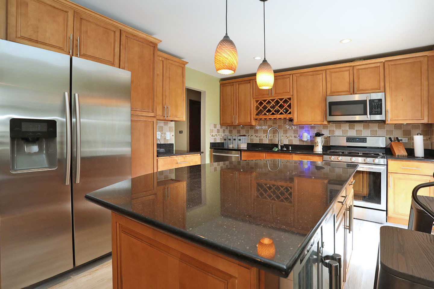 4624 Thornbark Drive Hoffman Estates, IL 60192 - Photo 5 of 30 a kitchen with stainless steel appliances granite countertop a sink a refrigerator and a stove