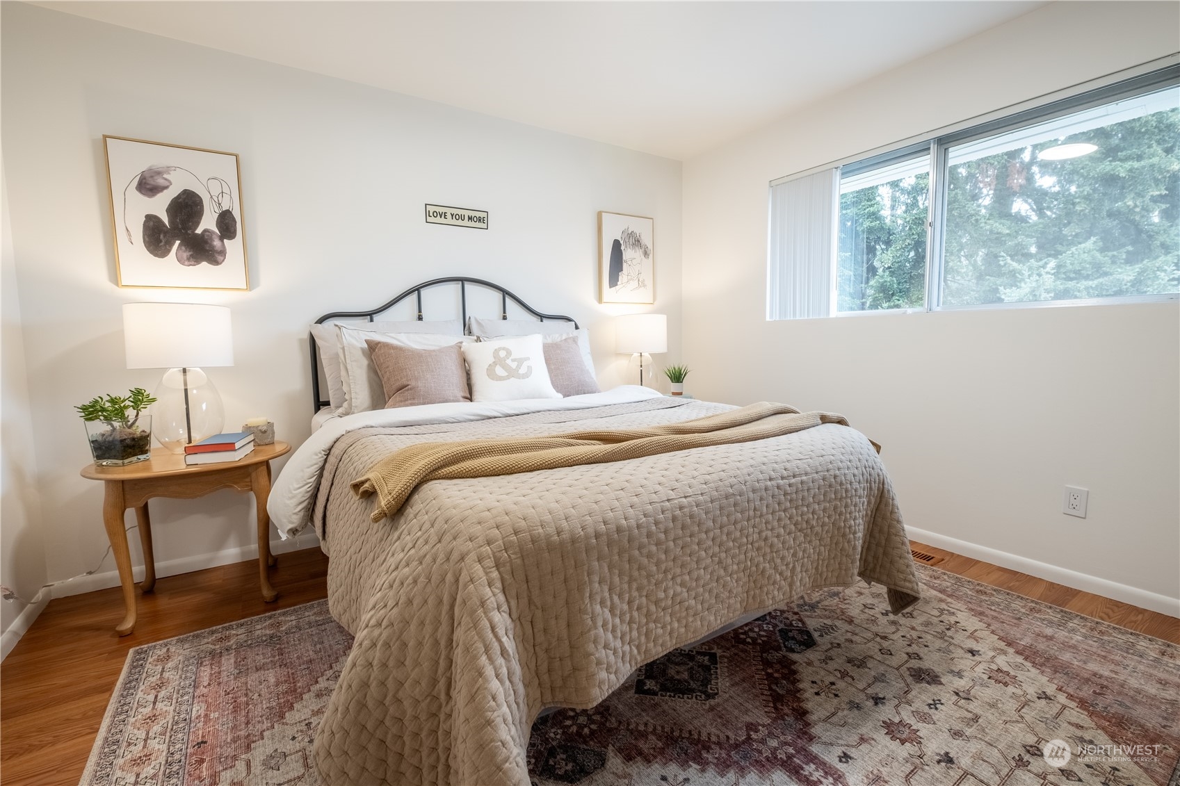4100 Northeast 11th Street Renton, WA 98059 - Photo 12 of 27 a bed sitting in a bedroom next to a window