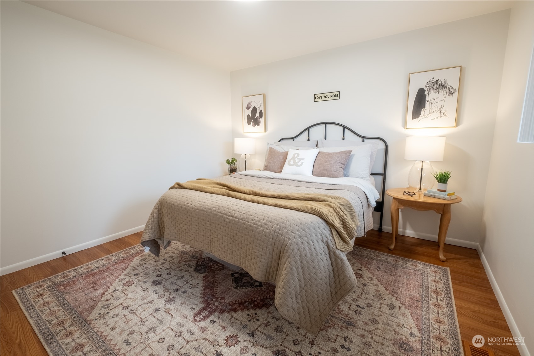 4100 Northeast 11th Street Renton, WA 98059 - Photo 13 of 27 a bedroom with a bed and a table in it
