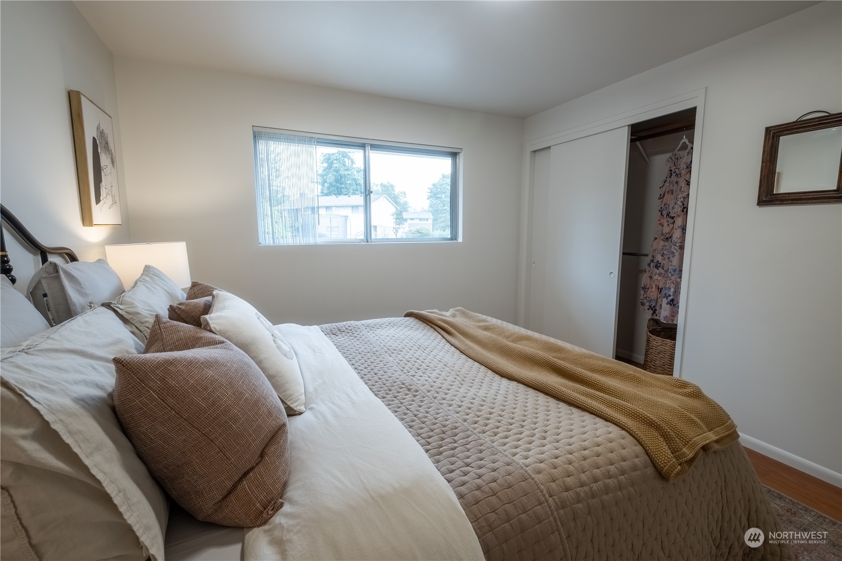 4100 Northeast 11th Street Renton, WA 98059 - Photo 14 of 27 a bedroom with a bed and a window