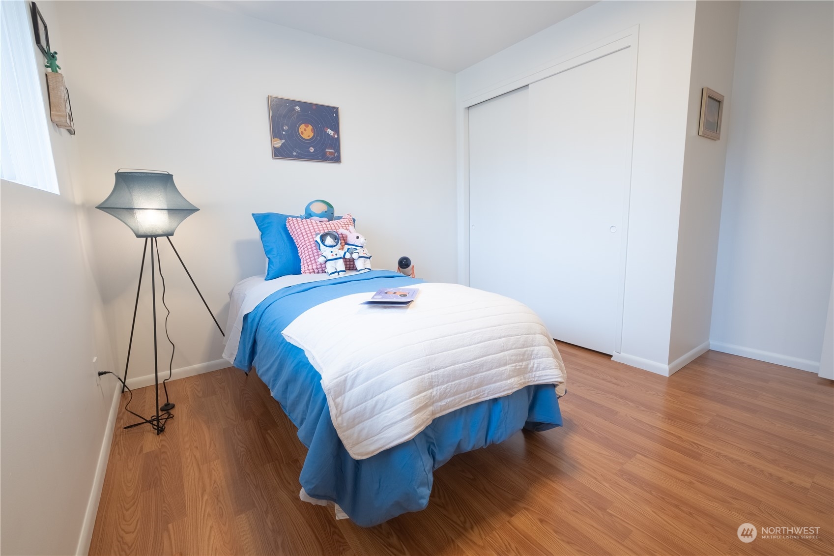 4100 Northeast 11th Street Renton, WA 98059 - Photo 16 of 27 a bedroom with a bed and a night stand