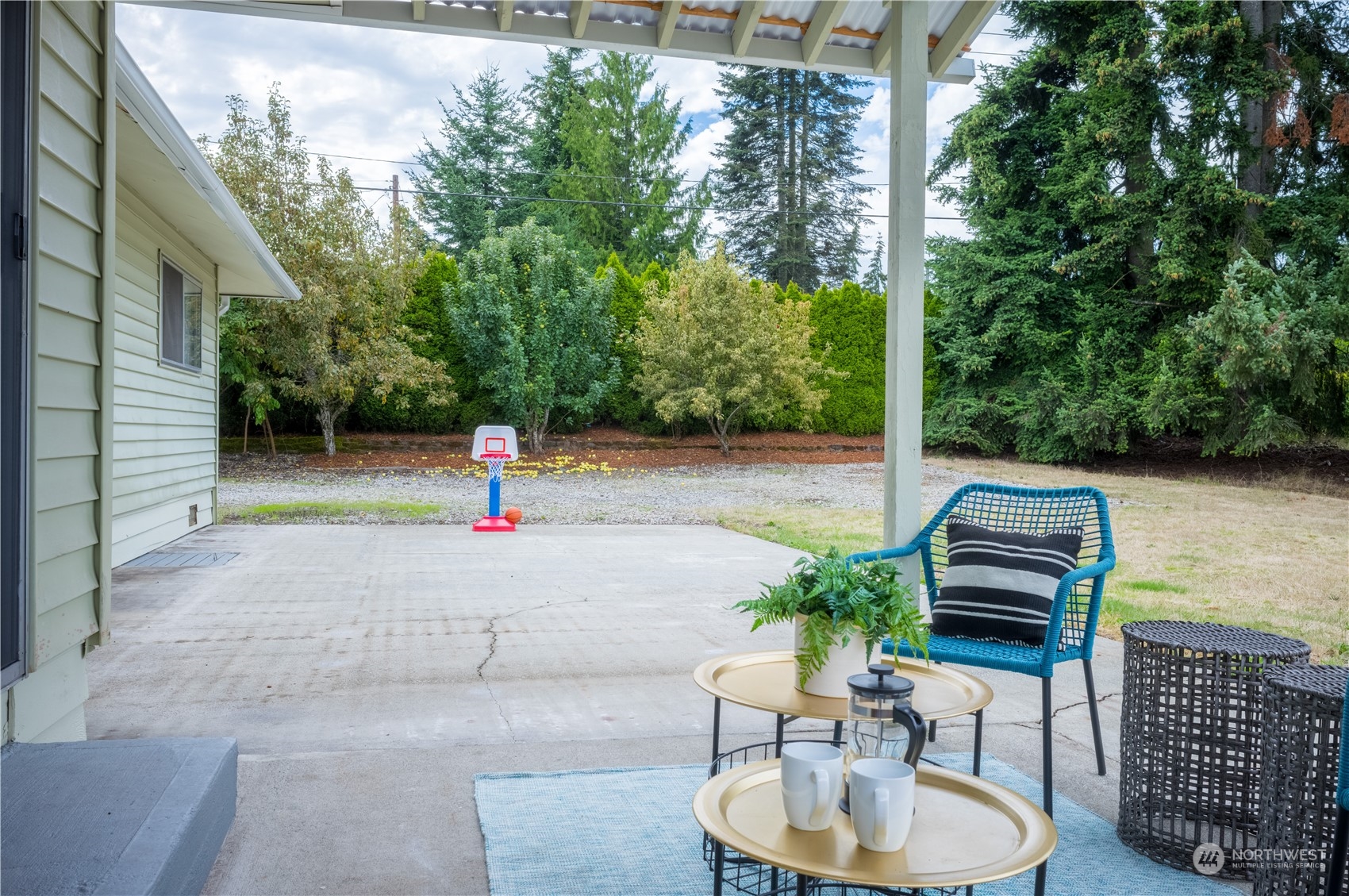 4100 Northeast 11th Street Renton, WA 98059 - Photo 20 of 27 a backyard of a house with outdoor seating
